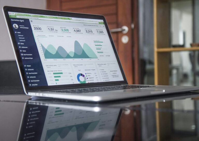 Laptop displaying analytics charts on a desk